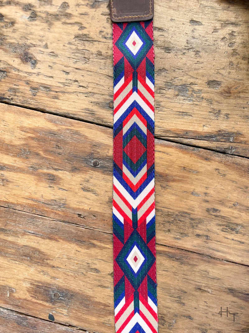 Photo of multi color aztec print strap with wood background