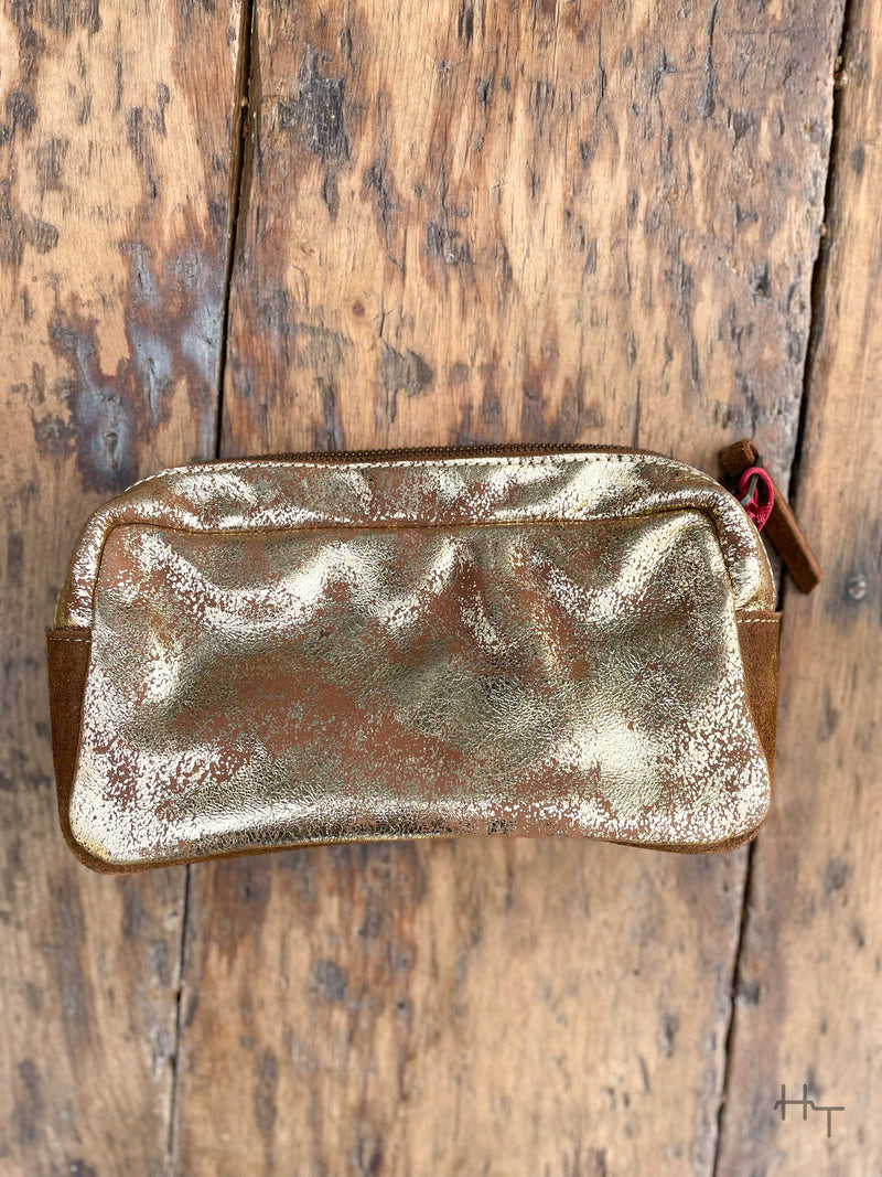 Photo of back of metallic gold leather cosmetic bag