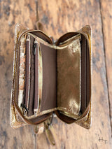 Photo of inside of metallic gold leather organization dividers