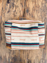 Photo of back of pastel aztec print woven cosmetic bag