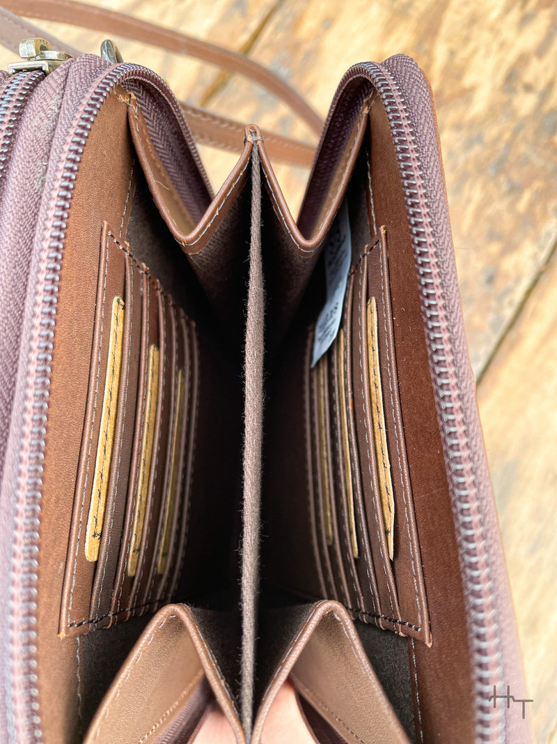 Photo of inside of zipper pocket of dark brown purse with divider and 6 card slots on each side